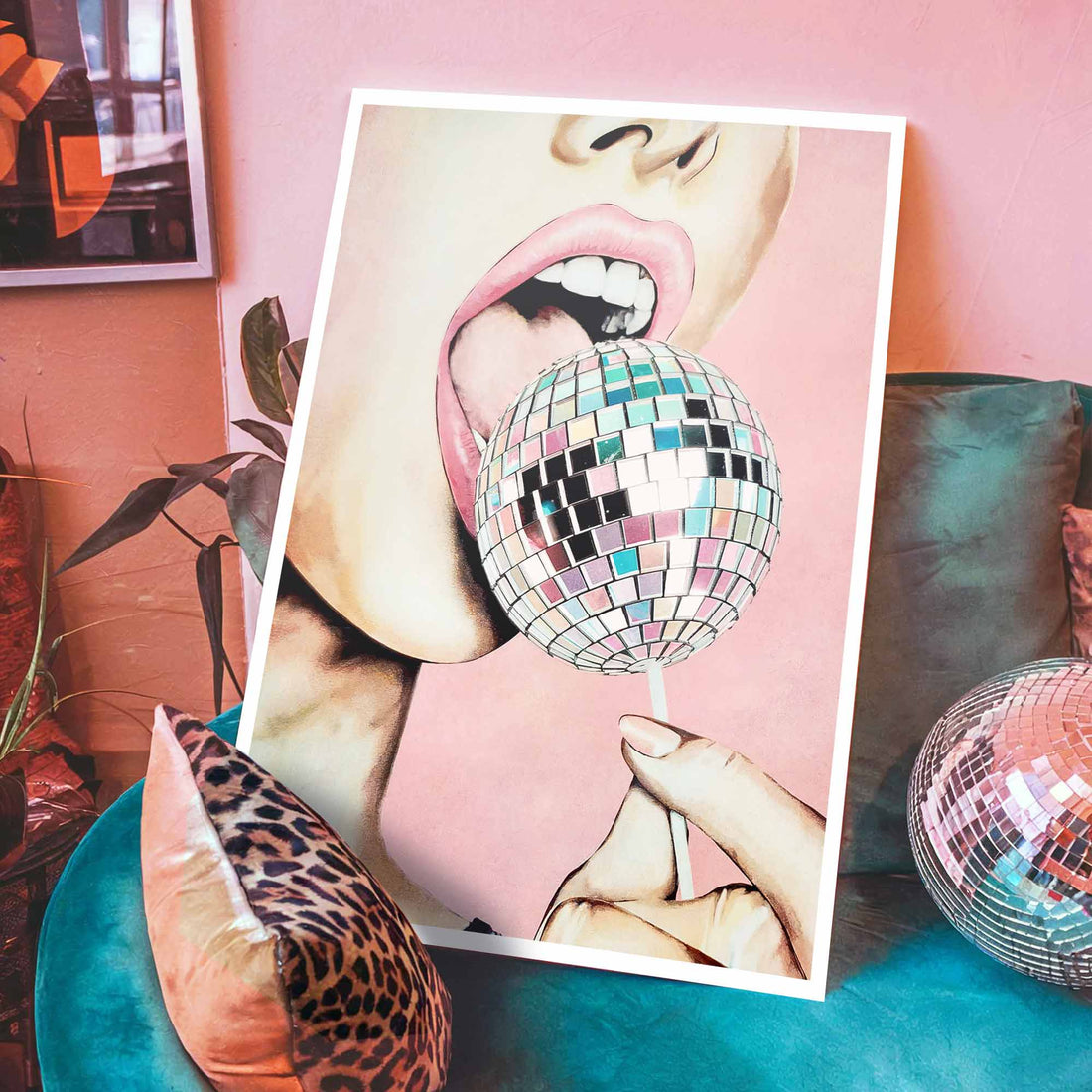 Statement wall art featuring a pink and chrome mirrorball lollipop.