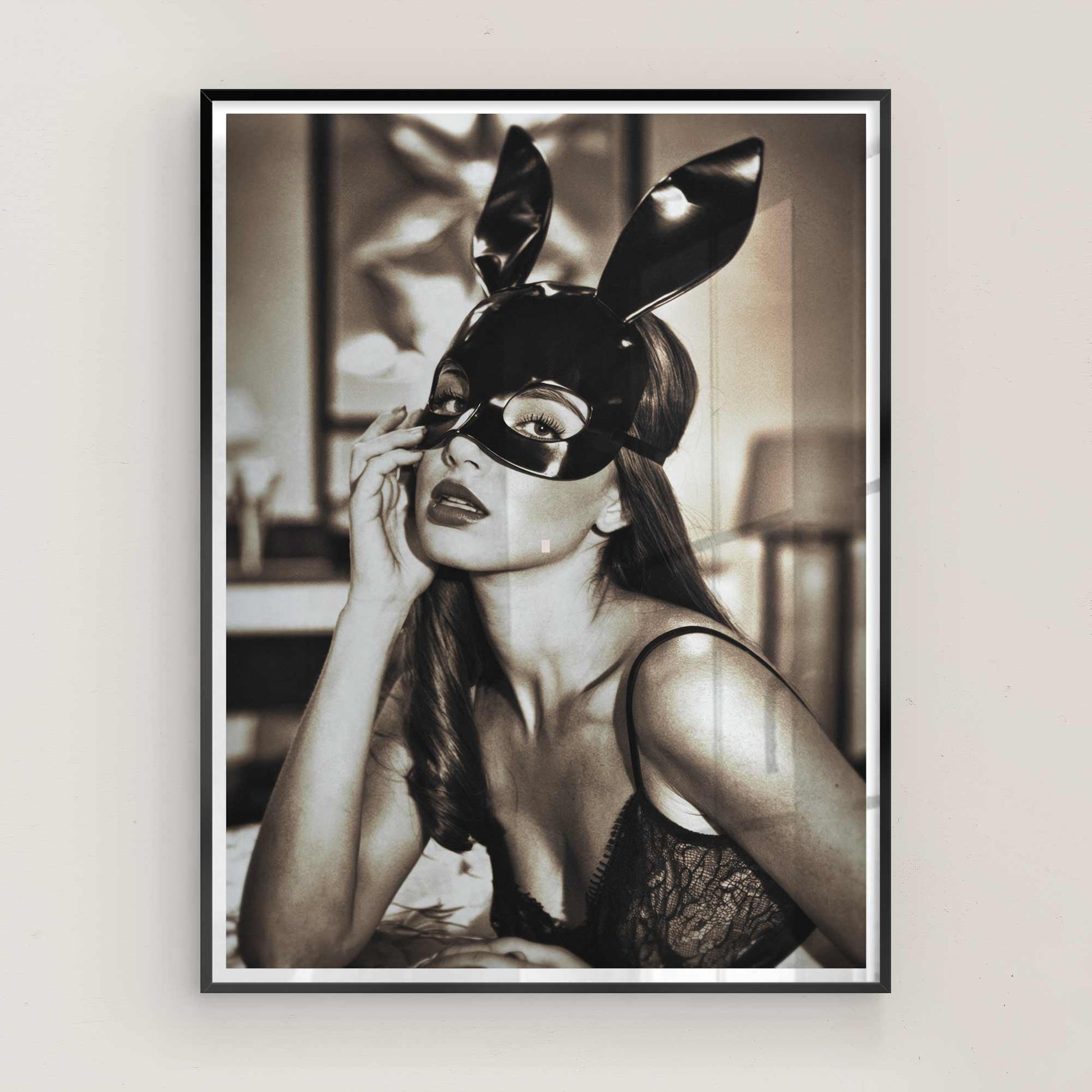 High-fashion editorial poster of a glamorous woman in a black bunny mask